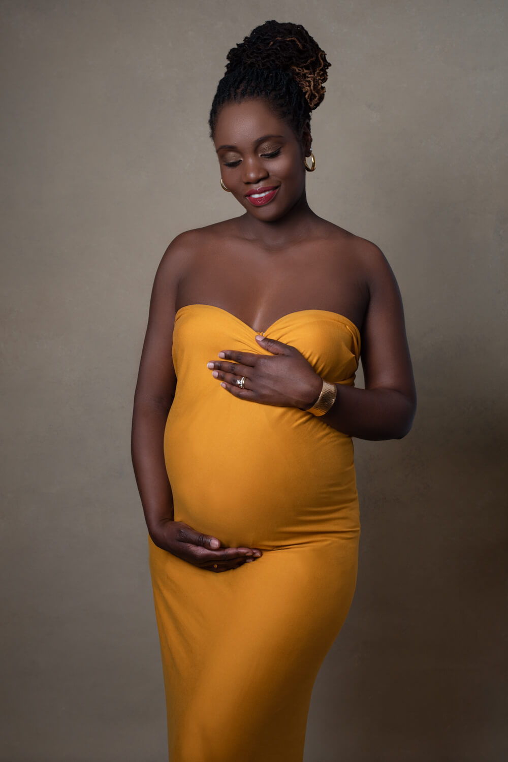 pregnant woman in a yellow dress